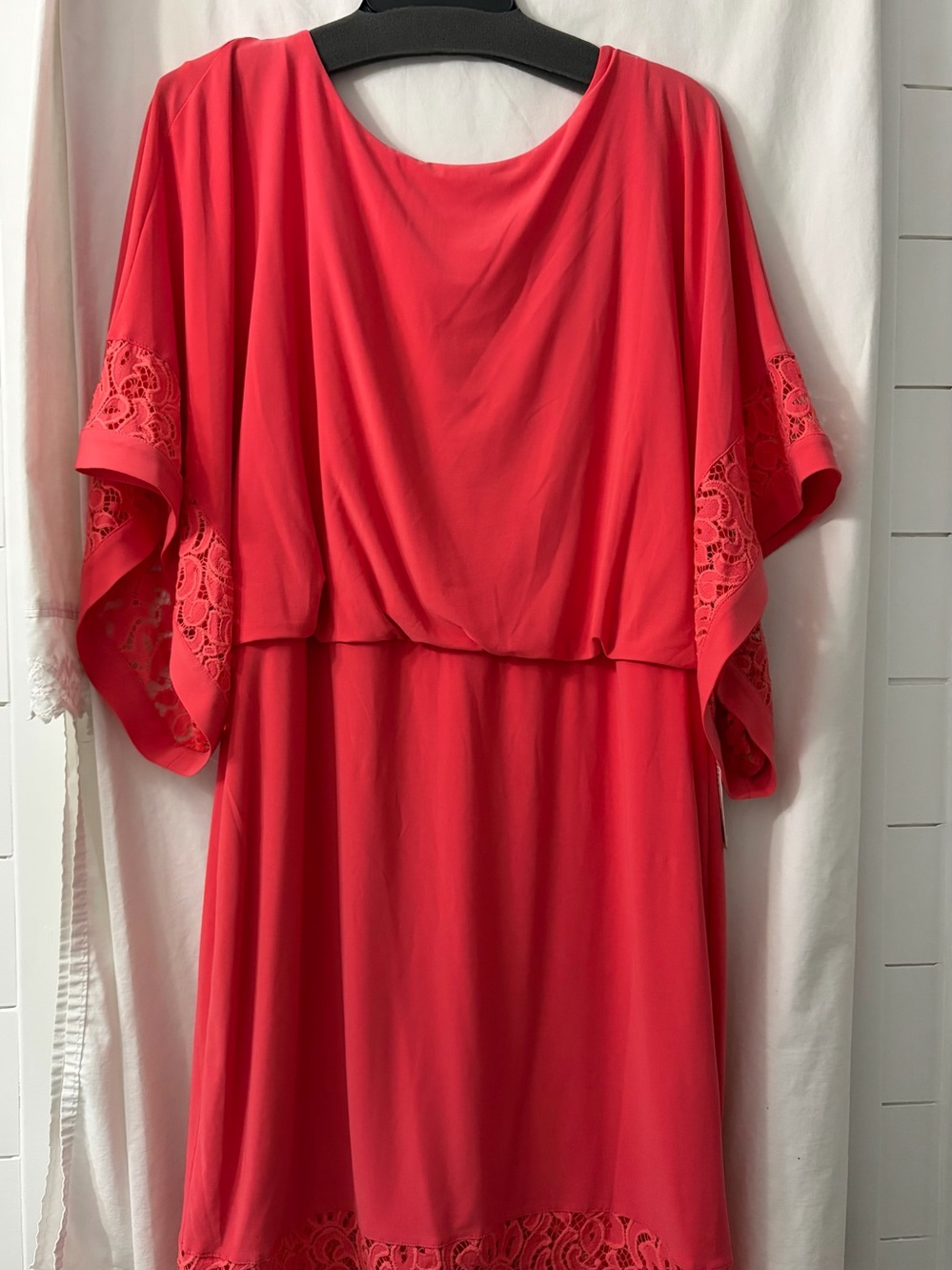 Coral colored decorative trimmed womans dress